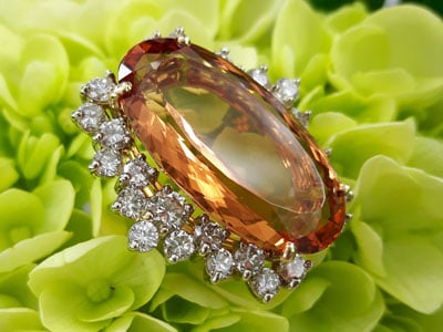 stock image: imperial topaz and diamond yellow gold ring
