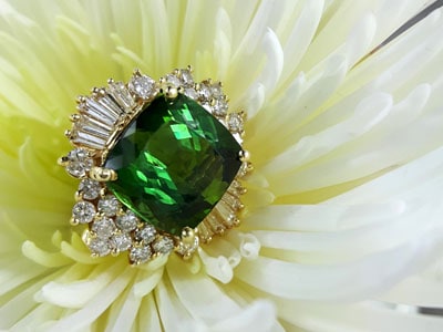 stock image: green tourmaline and diamond yellow gold ring