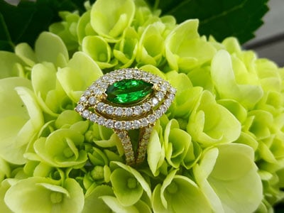 stock image: tsavorite green garnet and diamond gold ring