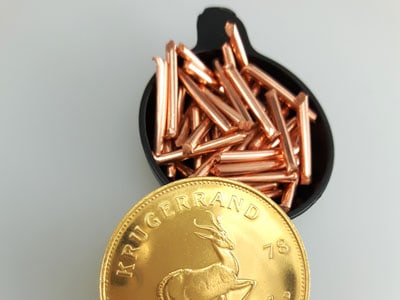 stock image: copper sticks used to create Krugerrand coin