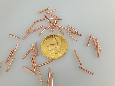 stock image: copper sticks, Krugerrand gold coin