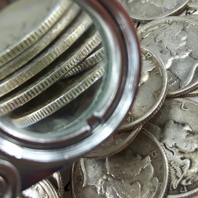 Mercury dime rim close-up with loupe