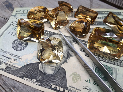 stock image: valuable gemstones and money, US dollars