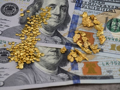 stock images: gold nuggets on cash