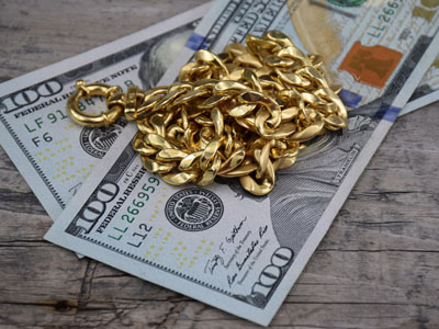 stock images: cash and gold jewelry, gold necklace