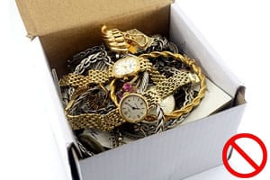 Box filled with gold jewelry and watches