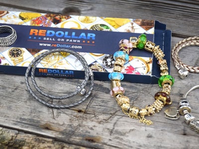 stock image: andora gold bracelet, ALE 585, Pandora leather bracelet, Pandora ring