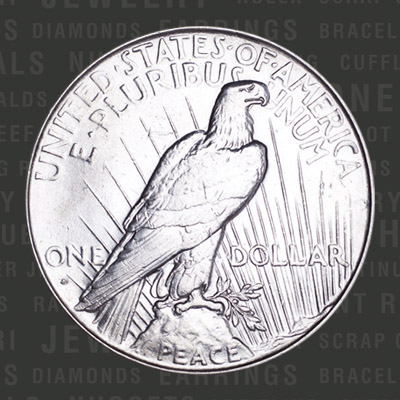 Peace silver dollar's reverse shows perched bald eagle