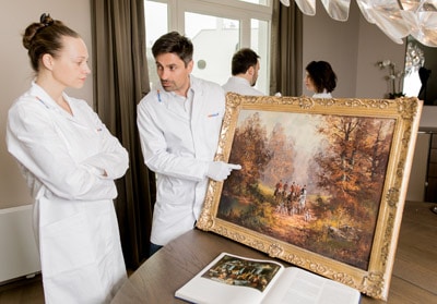 reDollar experts are checking important oil on canvas painting