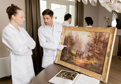 reDollar experts are checking important oil on canvas painting