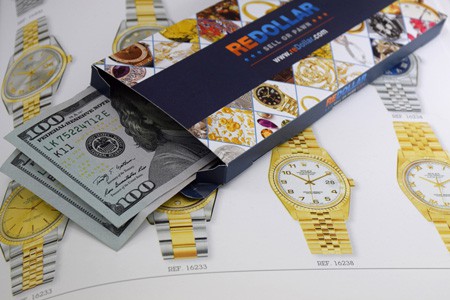 reDollar envelope with cash on Rolex literature