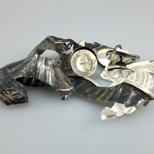 recovered sterling silver of an item marked Sterling Weighted