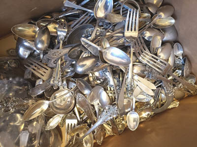 scrap silver spoons and forks, ready for melting