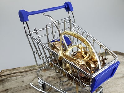 stock image: scrap gold carried and stored in shopping cart