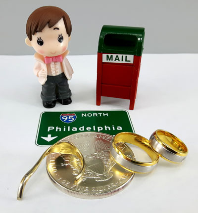 Philadelphia sign, silver coin, gold rings and scrap gold