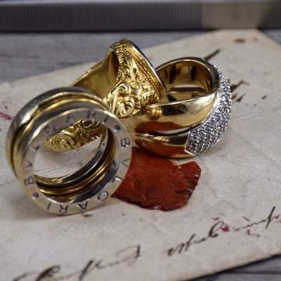designer gold ring, seal gold ring and diamond gold ring on antique sealed letter