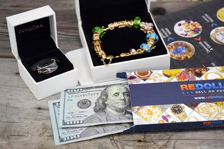 Pandora ring and Pandora 14k gold bracelet with cash and redollar envelope