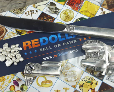 sterling silver knife, granules and handle on reDollar envelope