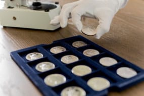 One ounce American Silver Eagle coins in soft tray storage