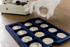 One ounce American Silver Eagle coins in soft tray storage