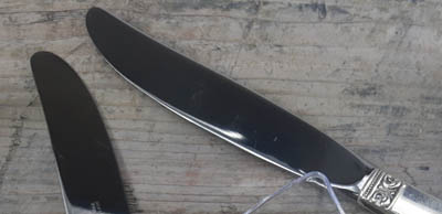 blades of a sterling silver knife