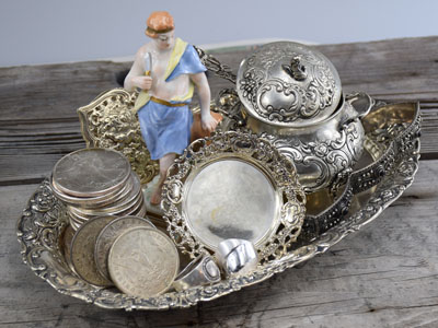 stock image: silver coins, porcelain figurine, antique silver