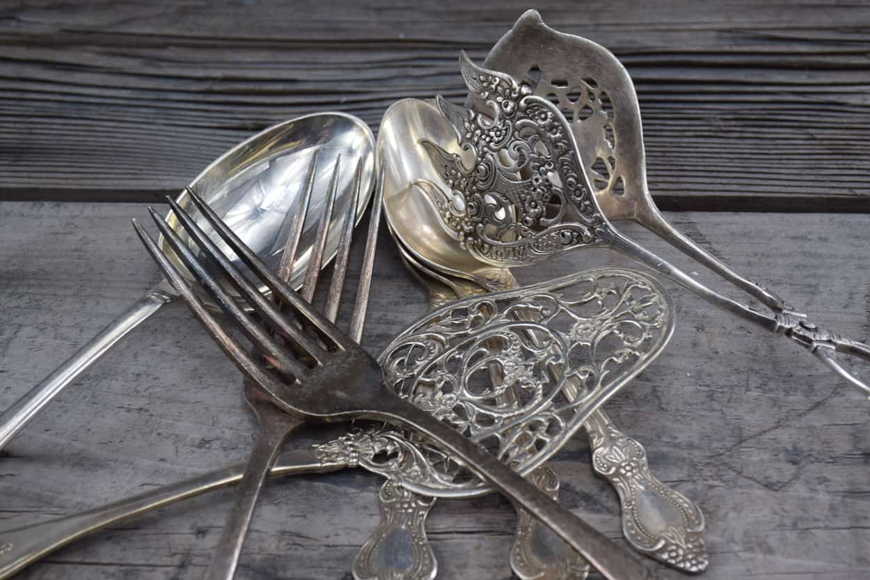 stock image: silverware, silver forks, silver spoons, silver tong