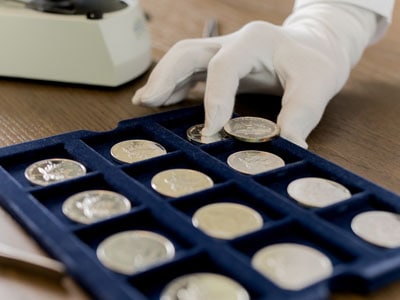 stock image: sort silver coins, store silver coins, trade silver coins