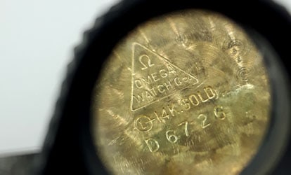 Watch case inside marked OMEGA 14k indicating the gold purity