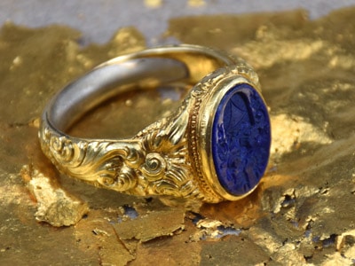 Men's gold ring with blue seal on 24k gold sheet