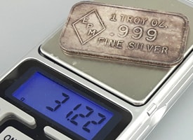 weighing a silver bar with digital scale