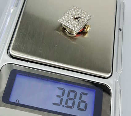 Weighing a Bulova diamond dial movement with a digital scale